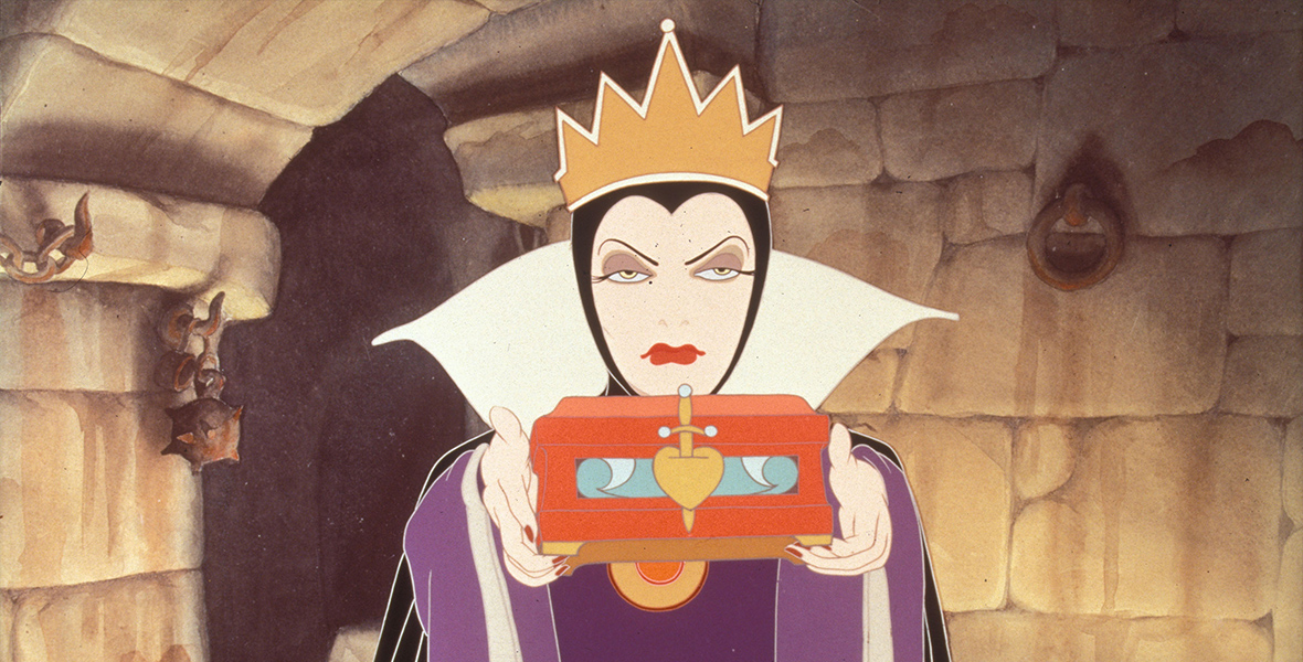 The animated Evil Queen holds a red box in front of her, with a gold heart impaled with a dagger on the front. In her dungeon, she shoots a menacing look straight ahead and wears a gold crown with purple robes and a black cape.
