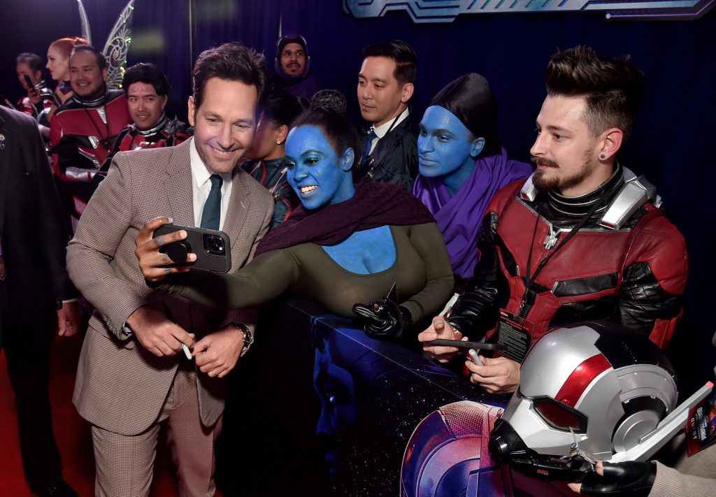 LOS ANGELES, CALIFORNIA - FEBRUARY 06: Paul Rudd poses with fans for a selfie during the Ant-Man and The Wasp Quantumania world premiere at Regency Village Theatre in Westwood, California on February 06, 2023. (Photo by Alberto E. Rodriguez/Getty Images for Disney)