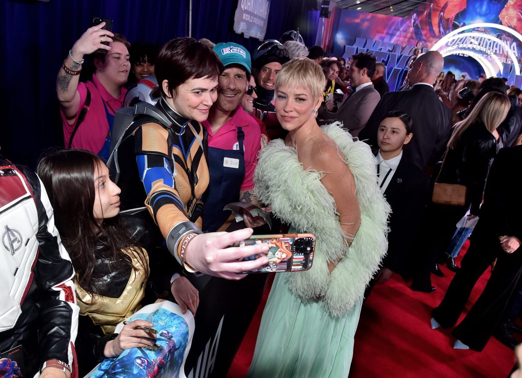 LOS ANGELES, CALIFORNIA - FEBRUARY 06: Evangeline Lilly poses with fans for a selfie during the Ant-Man and The Wasp Quantumania world premiere at Regency Village Theatre in Westwood, California on February 06, 2023. (Photo by Alberto E. Rodriguez/Getty Images for Disney)