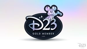 A black, oval magnet featuring the D23 logo and the words “Gold Member” in platinum text. A platinum Mickey Mouse is emerging from the 23, smiling and raising his hand.