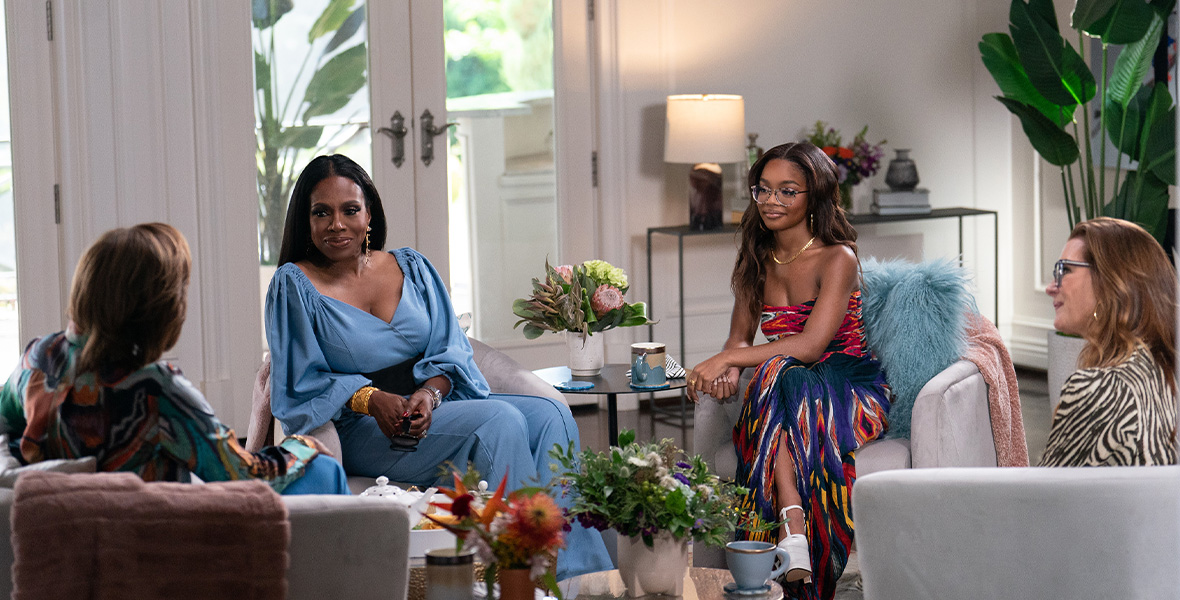 In a scene from an episode of Turning the Tables with Robin Roberts, Disney Legend Robin Roberts talks to actors Sheryl Lee Ralph, Marsai Martin, and Brooke Shields, who all sit in separate armchairs.