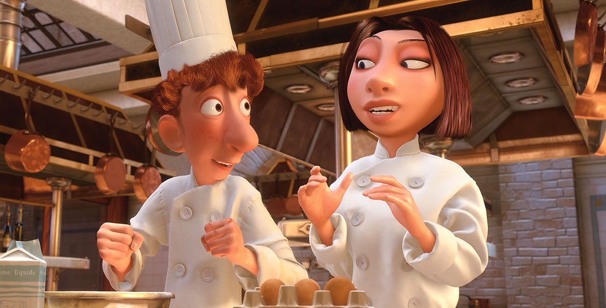 In the animated film Ratatouille, Colette stands beside Linguini in the kitchen of Gusteau’s restaurant. They wear their white uniforms and chef hats. Colette raises her hands to show Linguini how to keep his sleeves clean.