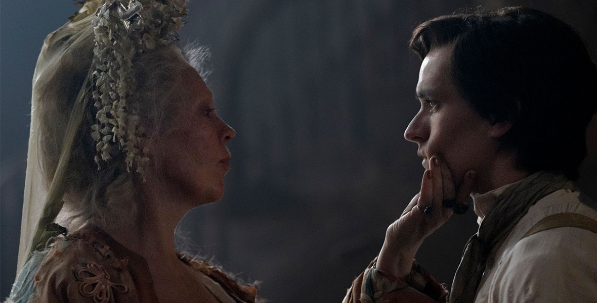In a scene from an episode of Great Expectations, actor Olivia Colman grabs the chin of actor Fionn Whitehead.