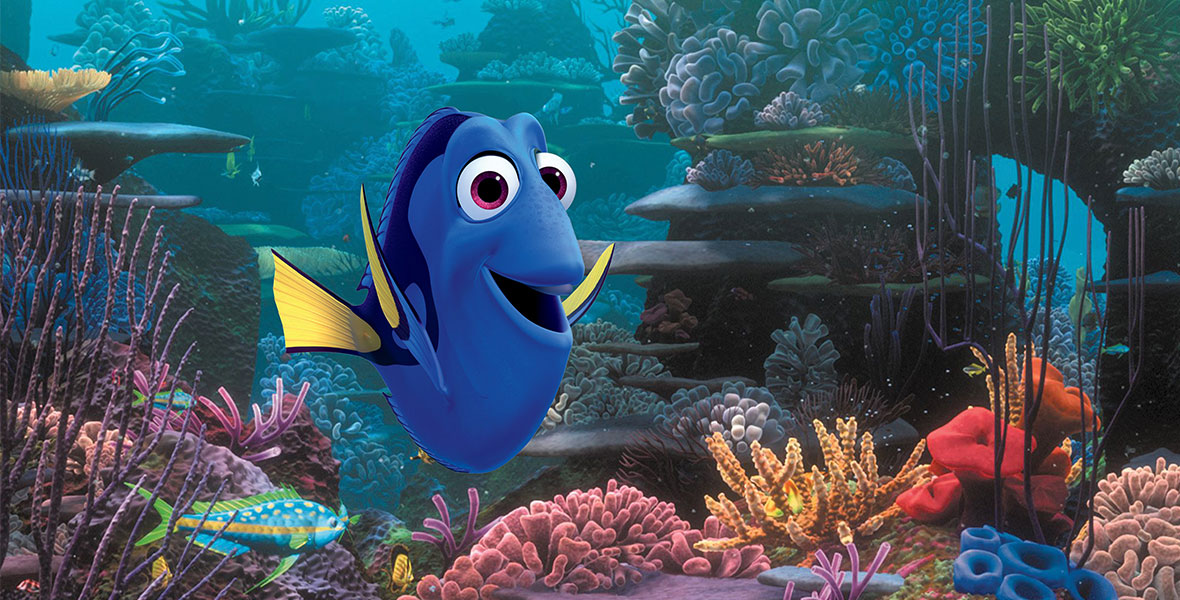 In the animated film Finding Nemo, Dory smiles at the camera as she swims in a coral reef. She’s a blue tang with yellow fins and magenta eyes.