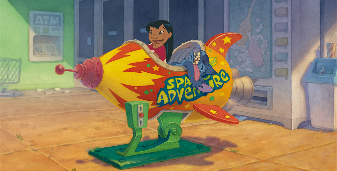 In the animated film Lilo and Stitch, little girl Lilo and blue alien Stitch ride in a toy rocket outside a store. “Space Adventure” is splattered on the rocket’s side. Lilo grins, but Stitch slouches over the side with his tongue hanging out.