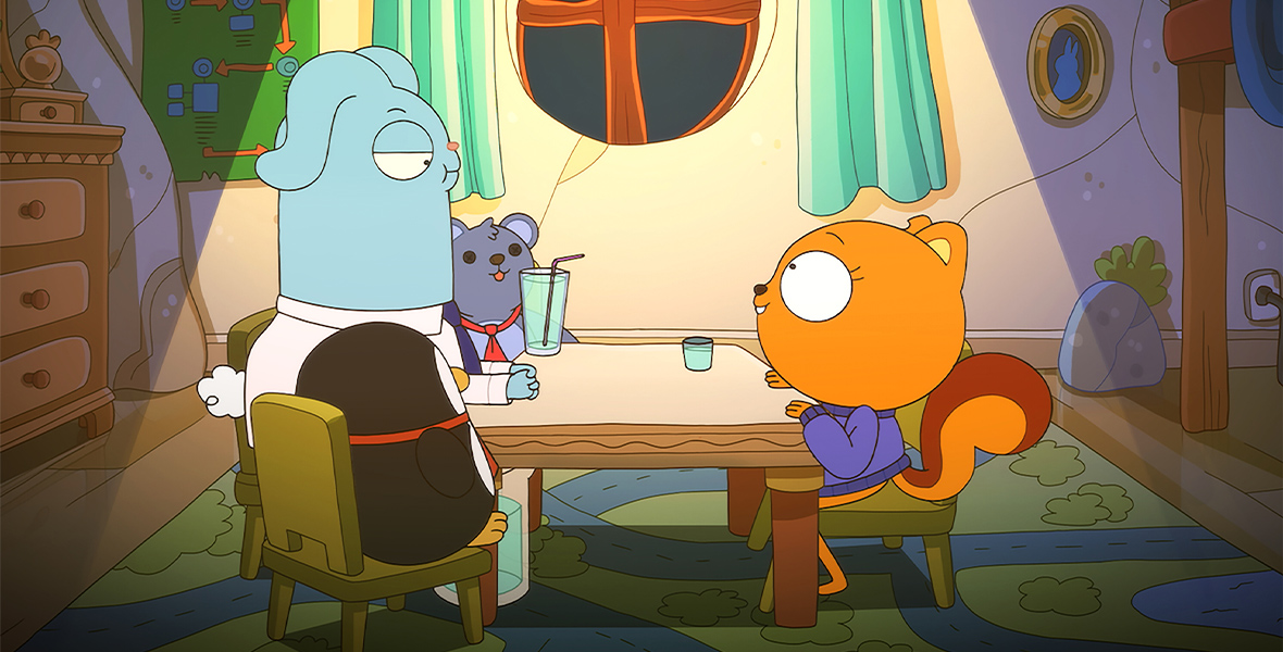 In the animated series Kiff, Kiff and Barry sit across the table from each other. Two stuffed animals, a penguin and bear, sit on either side of blue bunny Barry. He looks over at Kiff, who has a small glass of water beside her.