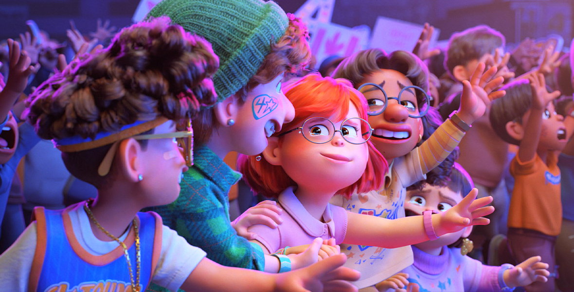 In the animated film Turning Red, Mei and her friends cry tears of joy at 4*Town’s concert. The four of them stand in the crowd and sport 4*Town face paint and shirts.