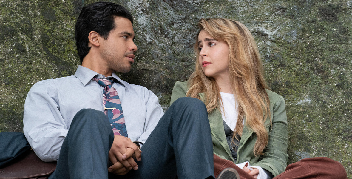 Carlos Valdez and Mae Whitman lean against a rock wall together in an image from the series Up Here.