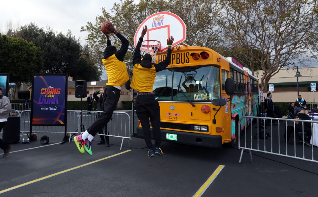 BURBANK, CALIFORNIA - MARCH 06: Players slam dunk during the Launch &amp; Screening Event for Disney's “Chang Can Dunk” at Walt Disney Studios in Hollywood, California on March 06, 2023. (Photo by Rich Polk/Getty Images for Disney)