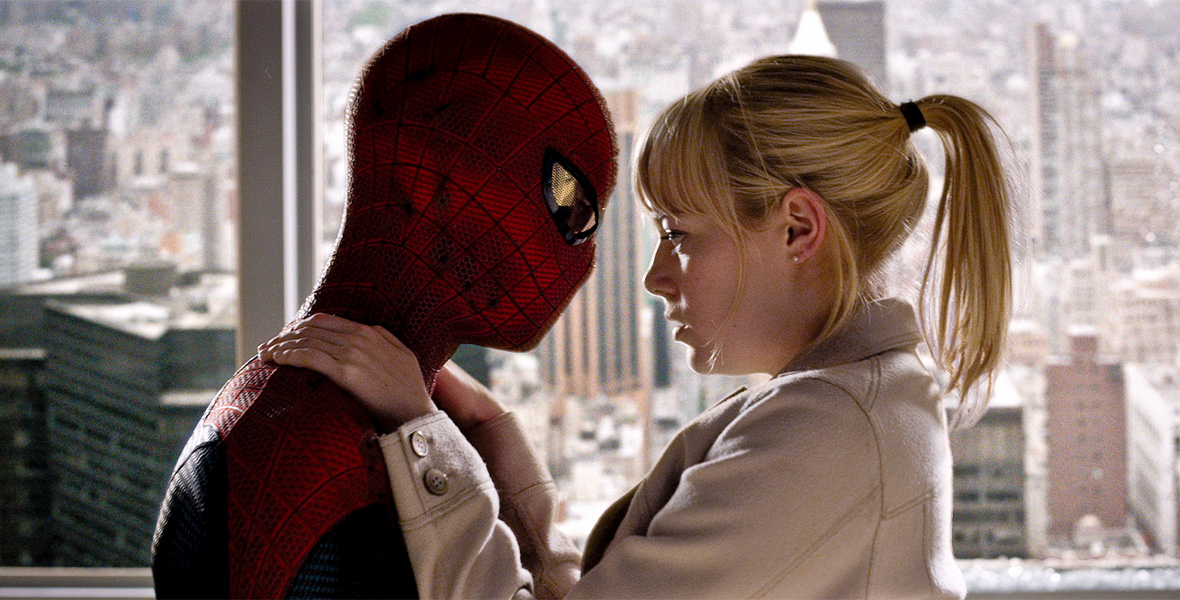 In a scene from The Amazing Spider-Man, actor Andrew Garfield plays Peter Parker/Spider-Man and holds actor Emma Stone as Gwen Stacy in his arms.