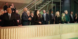 In a scene from an episode of General Hospital, actors Robert Gossett, Donnell Turner, Brook Kerr, Michael Easton, Kristina Wagner, Brooklyn Rae Silzer, and Tristan Rogers stand on a rooftop and look at the sky.