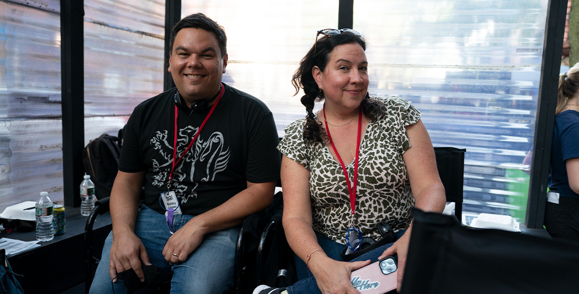 Robert Lopez and Kristen Anderson-Lopez smile on the set of Up Here.