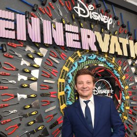 Jeremy Renner poses for photographers at the Rennervations premiere.