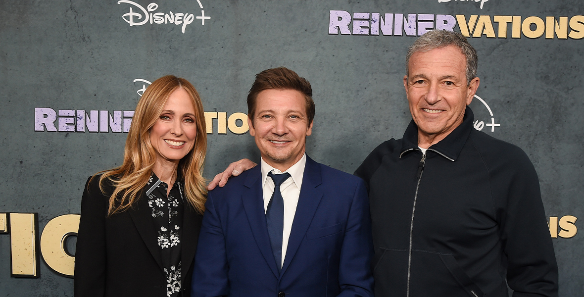 Dana Walden, Jeremy Renner, and Bob Iger pose for photographers at the Rennervations premiere.
