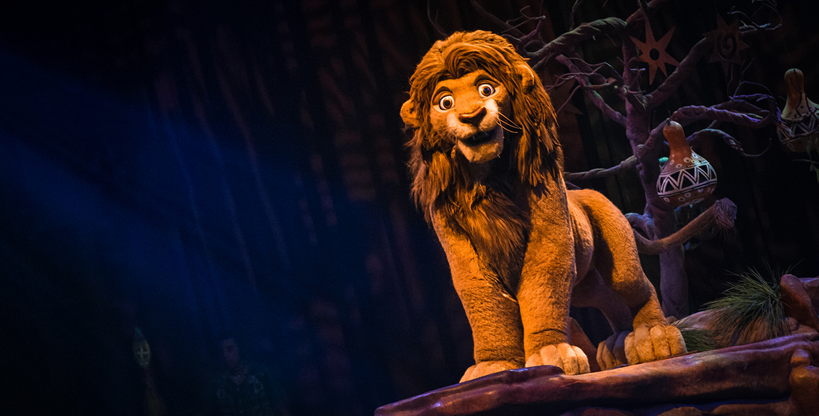 In the stage show Festival of the Lion King, an audio-animatronics figure of the adult lion Simba stands atop a rock and stares into the camera.