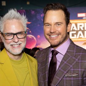 Director James Gunn (left) and actor Chris Pratt (right) smile on the purple carpet during the Guardians of the Galaxy Vol. 3 world premiere at the Dolby Theatre.