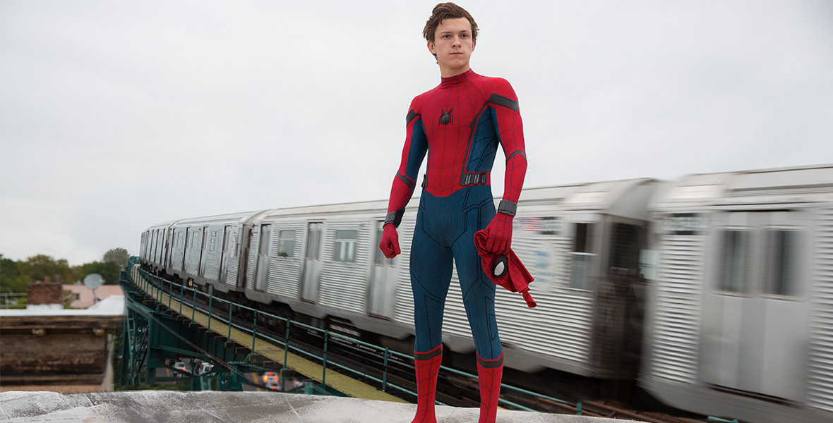 Actor Tom Holland plays Peter Parker aka Spider-Man and stands on top of a subway car in a scene from Spider-Man: Homecoming.