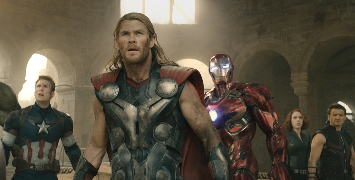 In the Avengers: Age of Ultron, the Avengers look ahead. Thor stands front and center, with Captain America and the Hulk to the left. Iron Man, Black Widow, and Hawkeye stand to his right.