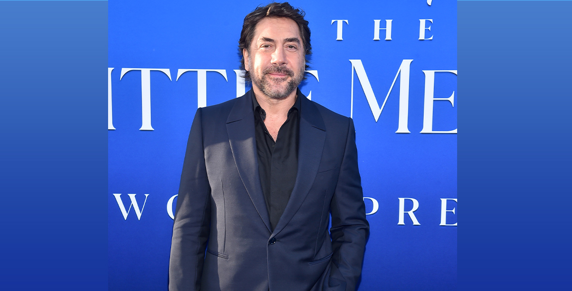 Javier Bardem stands in front of the blue step and repeat for the 2023 live action reimagining of The Little Mermaid