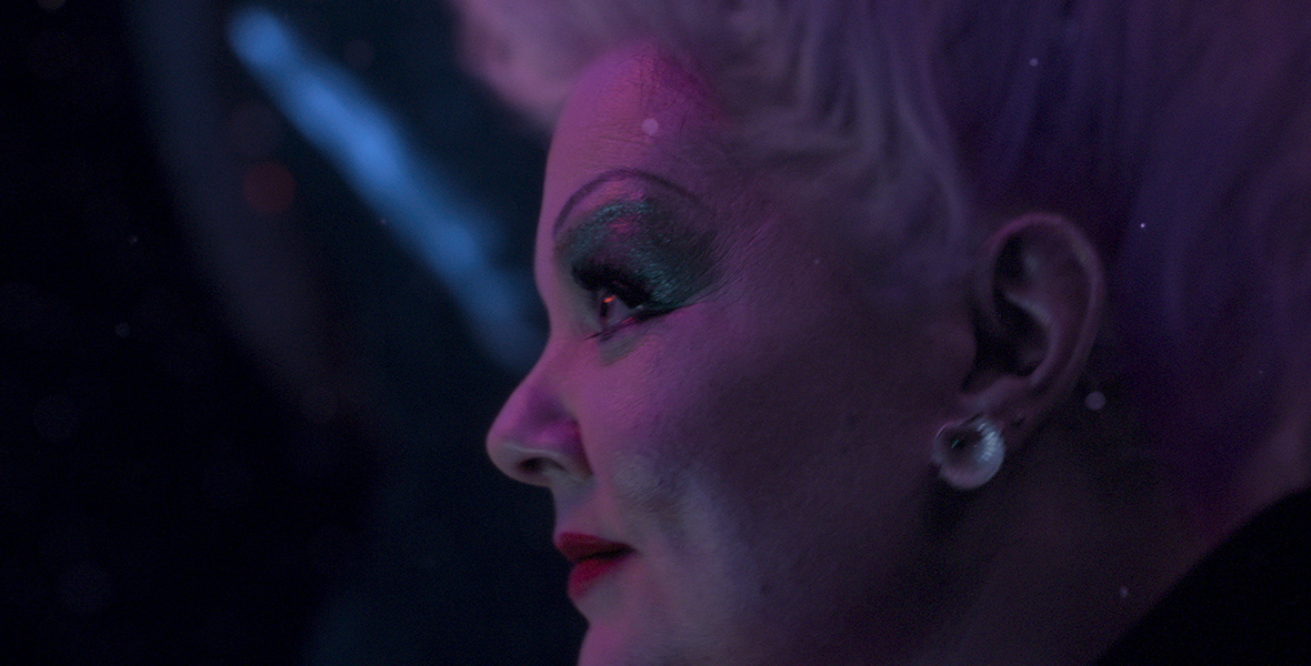 Ursula (Melissa McCarthy) is seen in profile in her underwater grotto as she plots how to ensnare Ariel.