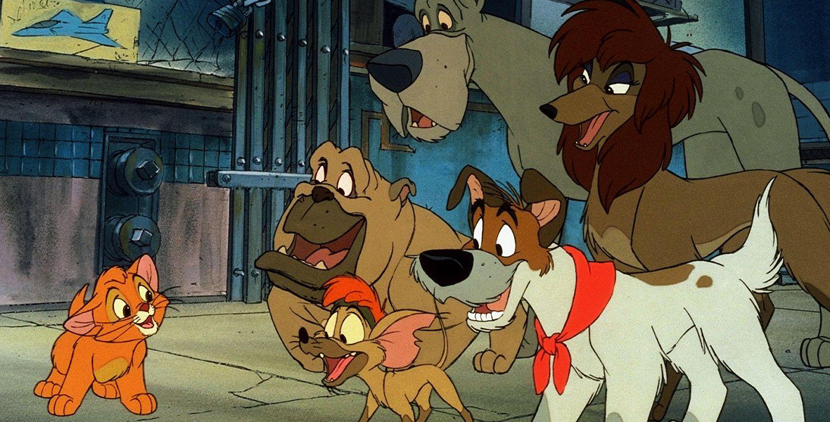 In a scene from Oliver & Company, Oliver, an orange cat, talks to a pack of dogs on a city sidewalk.