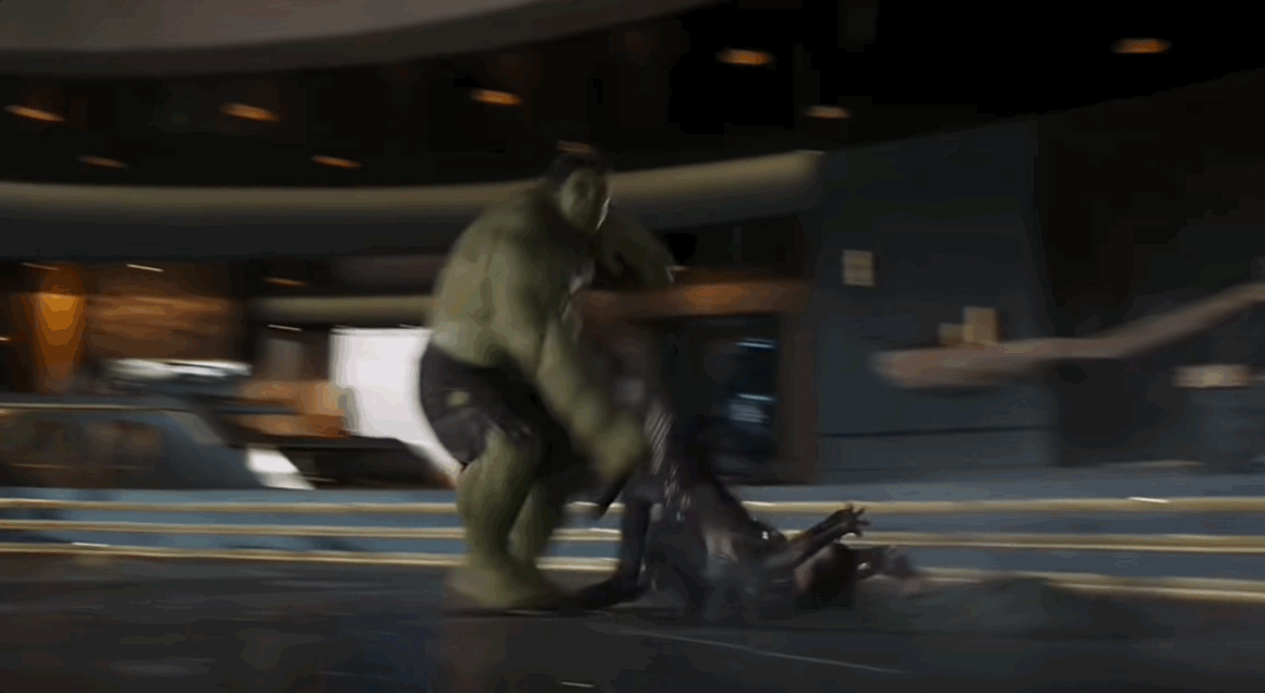 The Hulk picks Loki up by his feet and slams him into the ground, left and right.