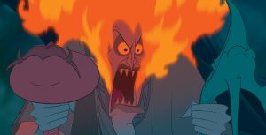 In the animated film Hercules, the god Hades grips his two minions, Pain and Panic, by their necks. His usual head of blue fire has erupted into orange flames in his anger. He shouts, his sharp teeth prominent under his yellow narrowed eyes.