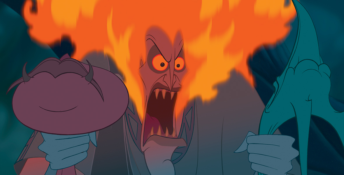 In the animated film Hercules, the god Hades grips his two minions, Pain and Panic, by their necks. His usual head of blue fire has erupted into orange flames in his anger. He shouts, his sharp teeth prominent under his yellow narrowed eyes.