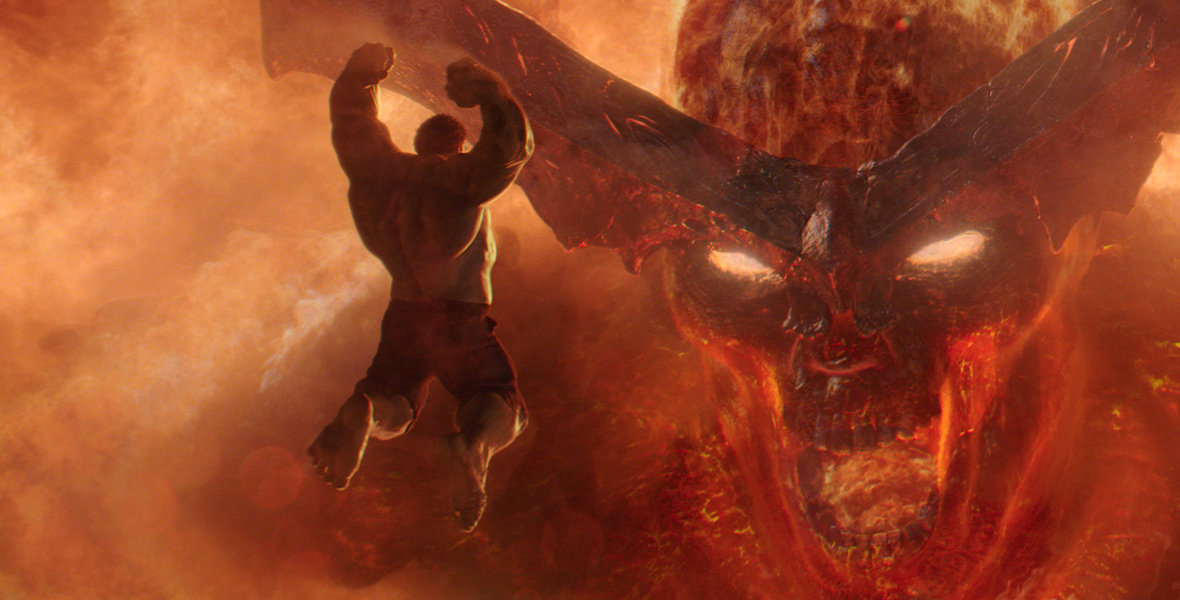 In Thor: Ragnarok, the fire demon Surtur takes up the whole screen. It’s a close-up of his fiery face and yellow glowing eyes. With his fists up, the green Hulk is airborne as he hurtles right toward Surtur’s face.