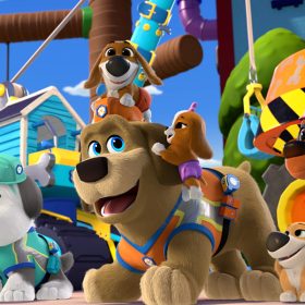 In a scene from the animated series Pupstruction, a corgi, sheepdog, rottweiler, and mastiff wear construction helmets near a construction site.