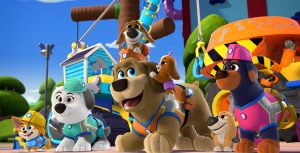 In a scene from the animated series Pupstruction, a corgi, sheepdog, rottweiler, and mastiff wear construction helmets near a construction site.