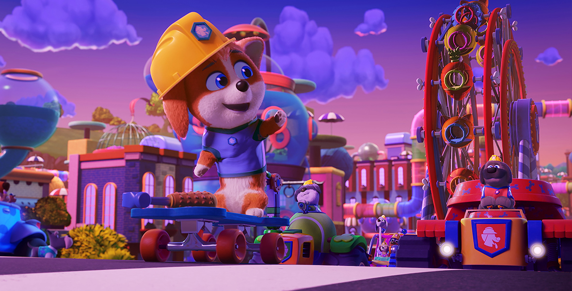 In a scene from the animated series Pupstruction, Phinny, a corgi, wears a construction helmet and looks at a colorful Ferris wheel.