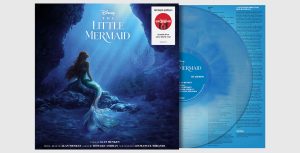 An image of the Target exclusive, limited-edition vinyl soundtrack for The Little Mermaid (2023). The album itself is opaque blue; on the cover is an image of Halle Bailey as Ariel, looking up at sunlight streaming through the ocean from above. The title of the film is above her, and a logo for Target and the words "Limited Edition, Oceanic Blue Color Blend Vinyl" are seen in the upper right corner.