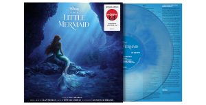 An image of the Target exclusive, limited-edition vinyl soundtrack for The Little Mermaid (2023). The album itself is opaque blue; on the cover is an image of Halle Bailey as Ariel, looking up at sunlight streaming through the ocean from above. The title of the film is above her, and a logo for Target and the words "Limited Edition, Oceanic Blue Color Blend Vinyl" are seen in the upper right corner.