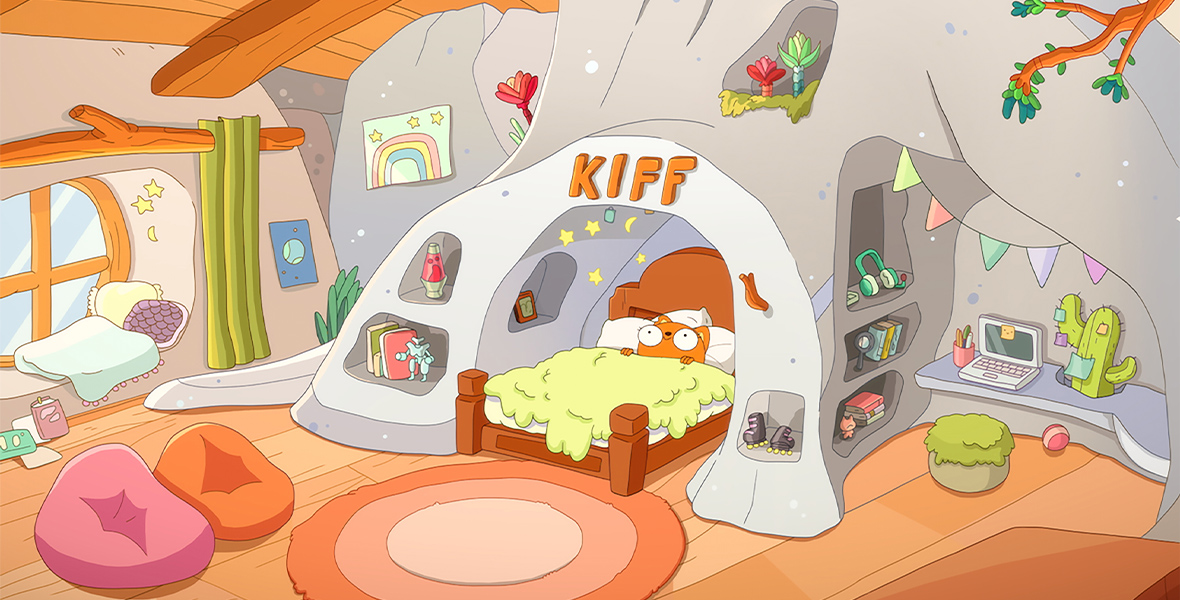 In an image from Disney Branded Television’s Kiff, Kiff (voiced by Kimiko Glenn) is laying in a bed that’s surrounded by a white bookshelf-style arch, featuring shelves, nooks, and crannies that contain fun items like books, headphones, roller skates, and more. At the apex of the arch is the name “KIFF” in bold letters. The rest of the bedroom is just as colorful and unique, with beanbag chairs, a window seat, lots of books strewn about, and even a cactus and other plants and tree branches.