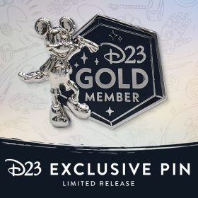 Photo of the D23-Exclusive 2023 Gold Member Specialty Pin—Limited Release, featuring a miniature likeness of our 2023 D23 Gold Member Gift—the Mickey Mouse “Leader of the Club” Milestone Statue. It also features text reading D23 Gold Member. The backer card is also inspired by the platinum finishes of the Disney 100 Celebration.