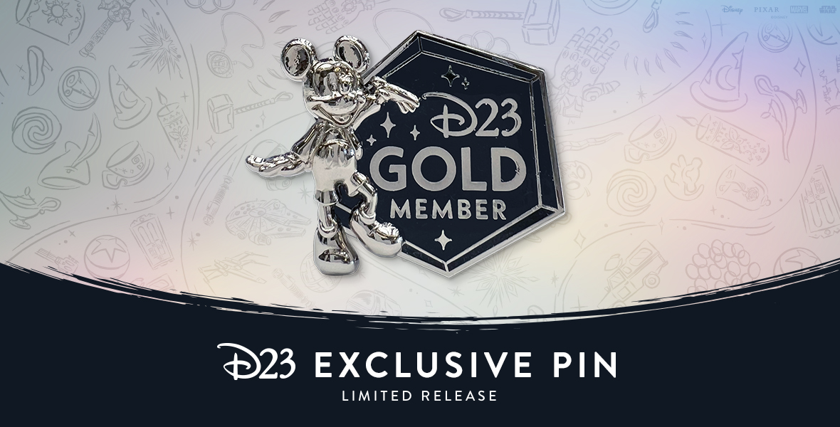 Photo of the D23-Exclusive 2023 Gold Member Specialty Pin—Limited Release, featuring a miniature likeness of our 2023 D23 Gold Member Gift—the Mickey Mouse “Leader of the Club” Milestone Statue. It also features text reading D23 Gold Member. The backer card is also inspired by the platinum finishes of the Disney 100 Celebration.