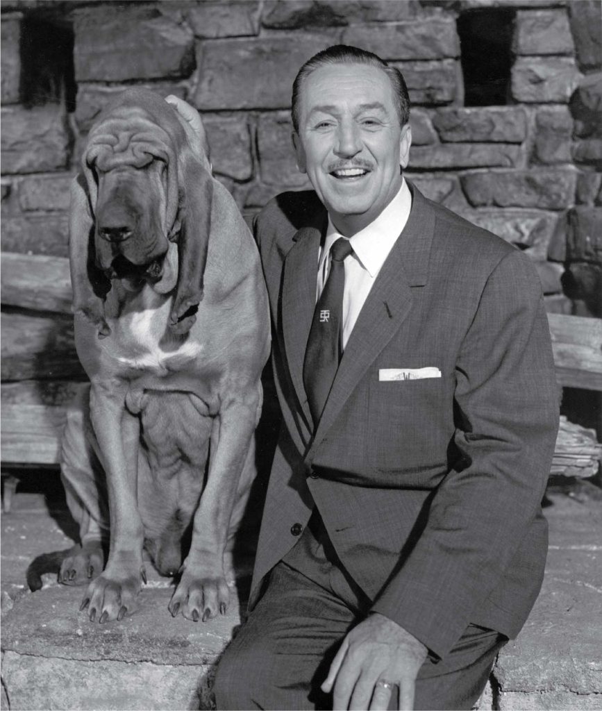 Photograph of Walt Disney and a dog, c. 1959