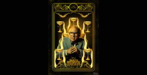 In a promotional image from Disney&rsquo;s Haunted Mansion that looks like a tarot card for &ldquo;The Cups,&rdquo; Professor Bruce Davis (Danny DeVito) is looking concerned, with his hands clasped, surrounded by yellow-hued cups that have drawn depictions of golden liquid pouring out of them, all set against a black background. He is wearing glasses, a bow tie, and a suit jacket. The logo for the film is at the bottom of the image, along with the date of the film&rsquo;s release.