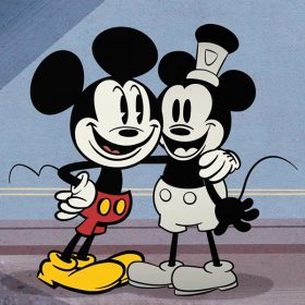 Mickey Mouse, wearing his iconic red shorts and yellow shoes, puts his arm around a black and white Mickey Mouse (inspired by the classic 1928 short Steamboat Willy) in a scene from The Wonderful World of Mickey Mouse short "Steamboat Silly."