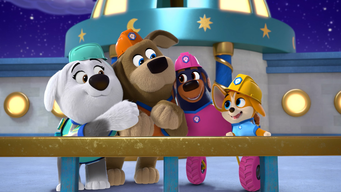 In a scene from the animated series Pupstruction, Roxy (voiced by Scarlett Kate Ferguson) stands next to Phinny, the leader of the Pupstruction crew. She wears a pink construction hat and outfit that matches her wheels.