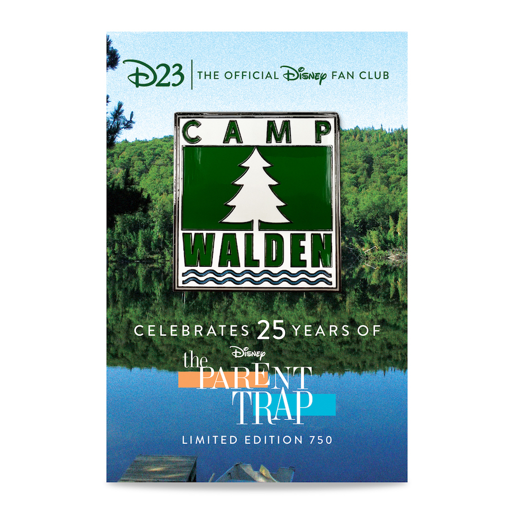 Product image of our The Parent Trap (1998) 25th Anniversary Pin and Backer Card. The pin features the insignia of Camp Walden. The backer features a lakeside setting reminiscent of the Camp Walden summer campsite.