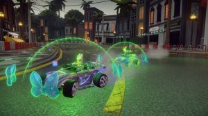 Daisy and Minnie are racing on a city street. Daisy is in the lead, smiling, while Minnie is barely hanging onto her steering wheel and nearly flying out of her car. They both are surrounded by green, shield-like domes that are encircled with digital-looking bows.