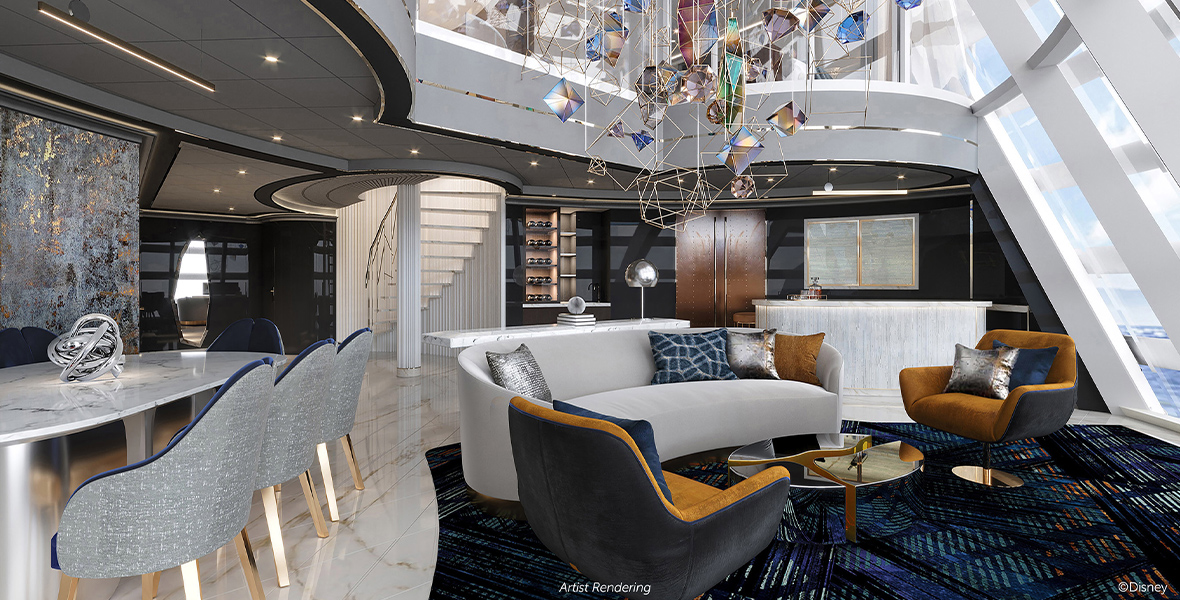 In an artist’s rendering of the living room area from the Tomorrow Tower Suite on board Disney Cruise Line’s Disney Treasure, a dining table can be seen on the left, with a couch and chairs to the right. A large, geodesic sculpture is hanging from the ceiling over the seating area. Towards the back of the image, part of a staircase can be seen. To the far right, part of a large two-story window overlooking the horizon. The upper level of the suite can partially be seen at the top of the image. The feel of the room is futuristic, with a lot of blues, silvers, and browns.