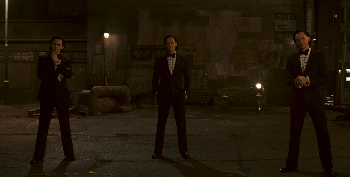 In an image from Season 2 of Loki on Disney+, Tom Hiddleston as the God of Mischief is seen three times—wearing a ‘’70s-era tuxedo, complete with frilly-chested button-down shirt and a wide bow tie.