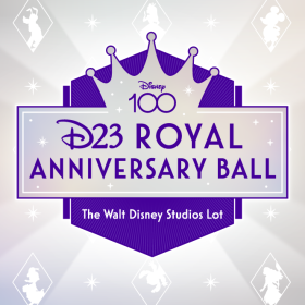 In a promotional image for the D23 Royal Anniversary Ball, a light purple and silver banner with white stars scattered on it and a crown coming out of the top of it has “D23 Royal Anniversary Ball” written on it in darker purple text. “Disney 100” is written in the middle of the crown. Behind the banner is a dark purple six-sided shape with a point on the bottom and top. The bottom half of this shape says “The Walt Disney Studios Lot” in white text. The background is silver with white stars, and white diamond outlines scattered throughout. Inside the white diamond outlines are white outlines of various Disney characters.