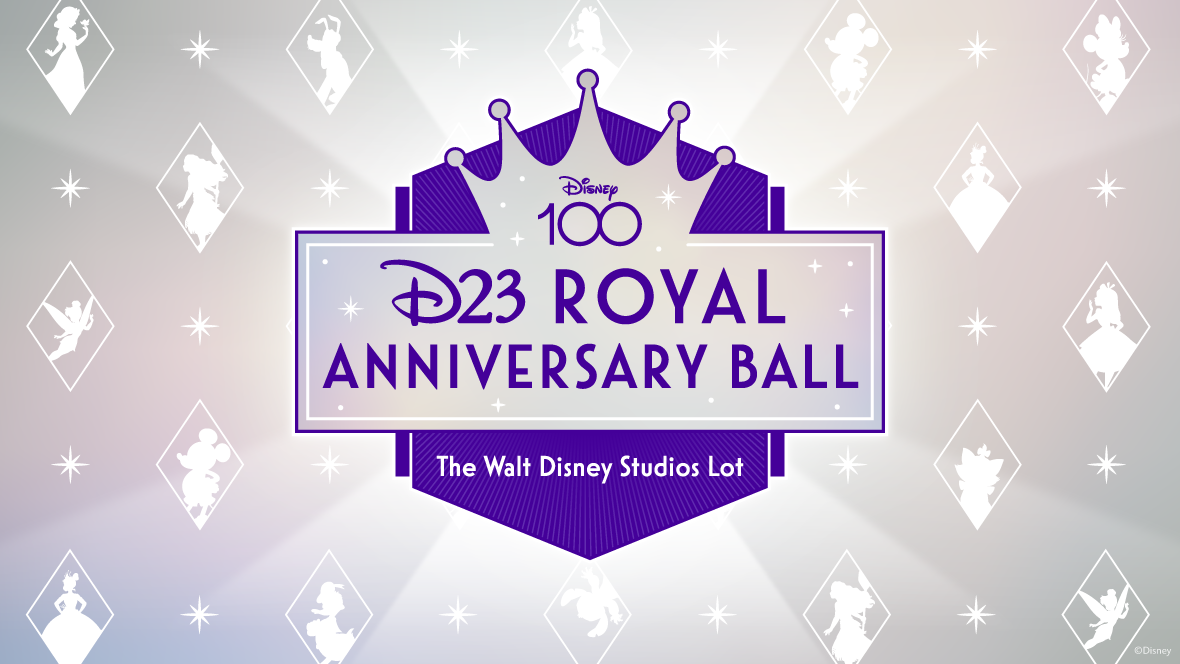 In a promotional image for the D23 Royal Anniversary Ball, a light purple and silver banner with white stars scattered on it and a crown coming out of the top of it has “D23 Royal Anniversary Ball” written on it in darker purple text. “Disney 100” is written in the middle of the crown. Behind the banner is a dark purple six-sided shape with a point on the bottom and top. The bottom half of this shape says “The Walt Disney Studios Lot” in white text. The background is silver with white stars, and white diamond outlines scattered throughout. Inside the white diamond outlines are white outlines of various Disney characters.