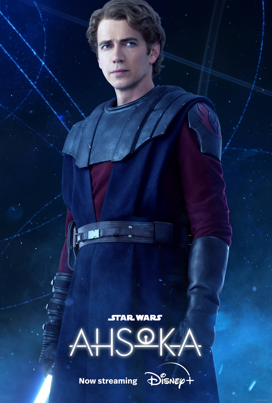Anakin Skywalker, from Ahsoka, played by Hayden Christiansen is wearing a maroon shirt, a blue overcoat vest, black gloves, and black shoulder armor while standing in front of a blue galaxy background. Star Wars Ahsoka is written in white on the bottom with now streaming written beneath that with the Disney plus logo written beside now streaming.
