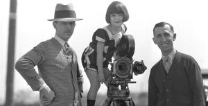 Walt Disney, Margie Gay, and Roy Disney on the set of an Alice Comedy.