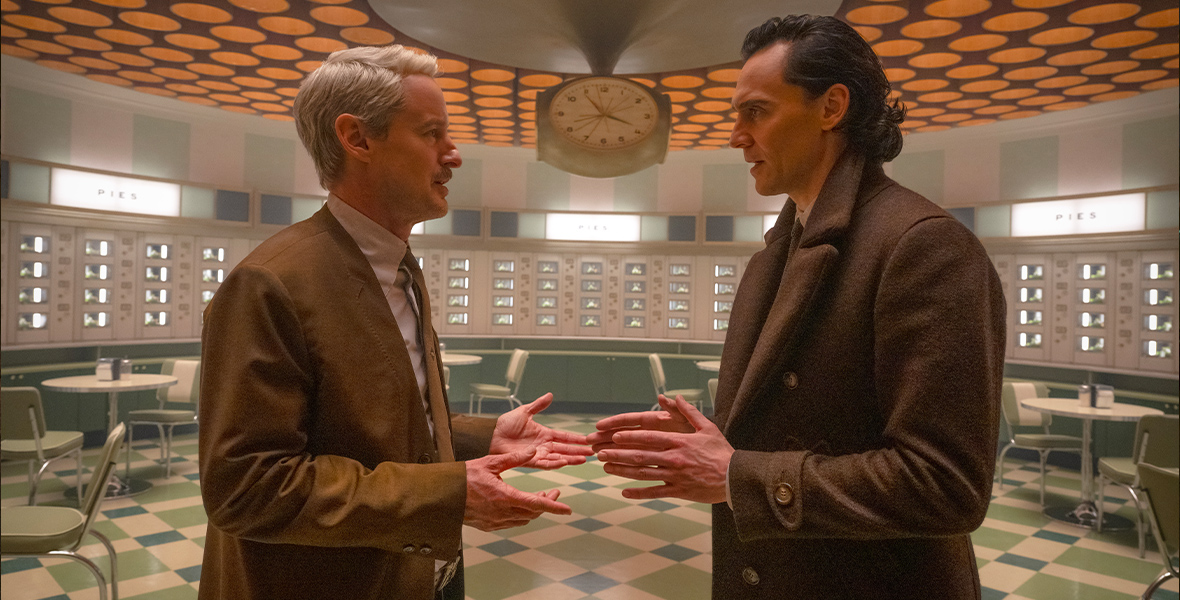 Mobius, played by Owen Wilson, faces Loki, played by Tom Hiddleston, during an intense conversation. They are meeting in the retro Time Variance Authority commissary.